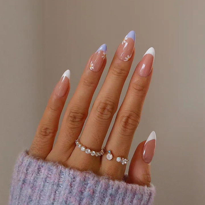 Artful nail extensions with an elegant leaf pattern Stornfield