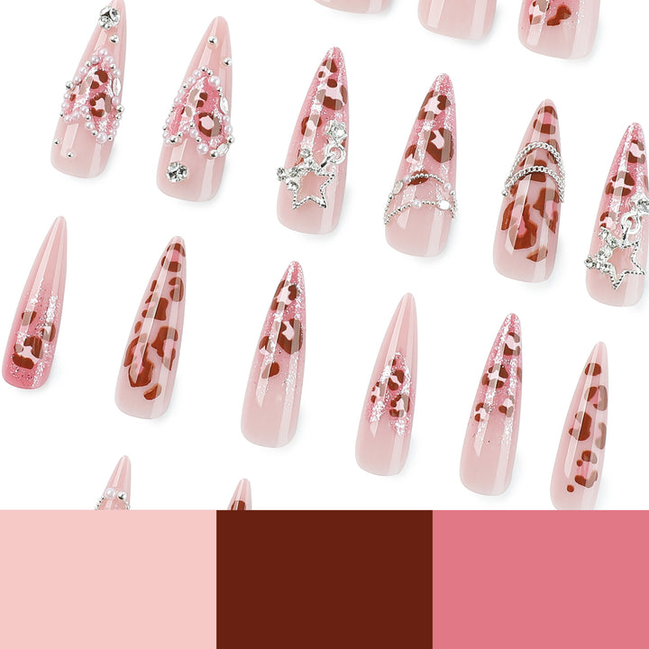 Artistic stiletto nails with glitter and jewelry accents Stornfield