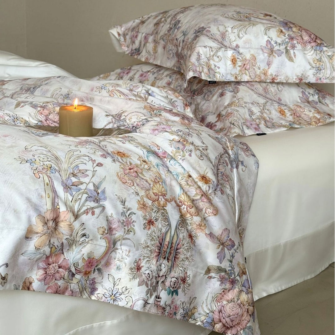 Fine cotton satin bed linen set with watercolor floral ornamentation and hotel closure
