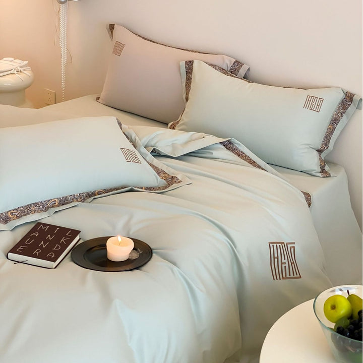 Luxurious bedding set made of cotton satin with paisley border and monogram embroidery