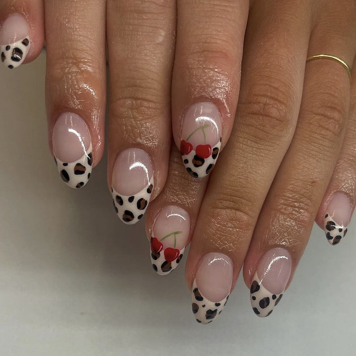 Artful animal pattern nails with cherry accents Stornfield