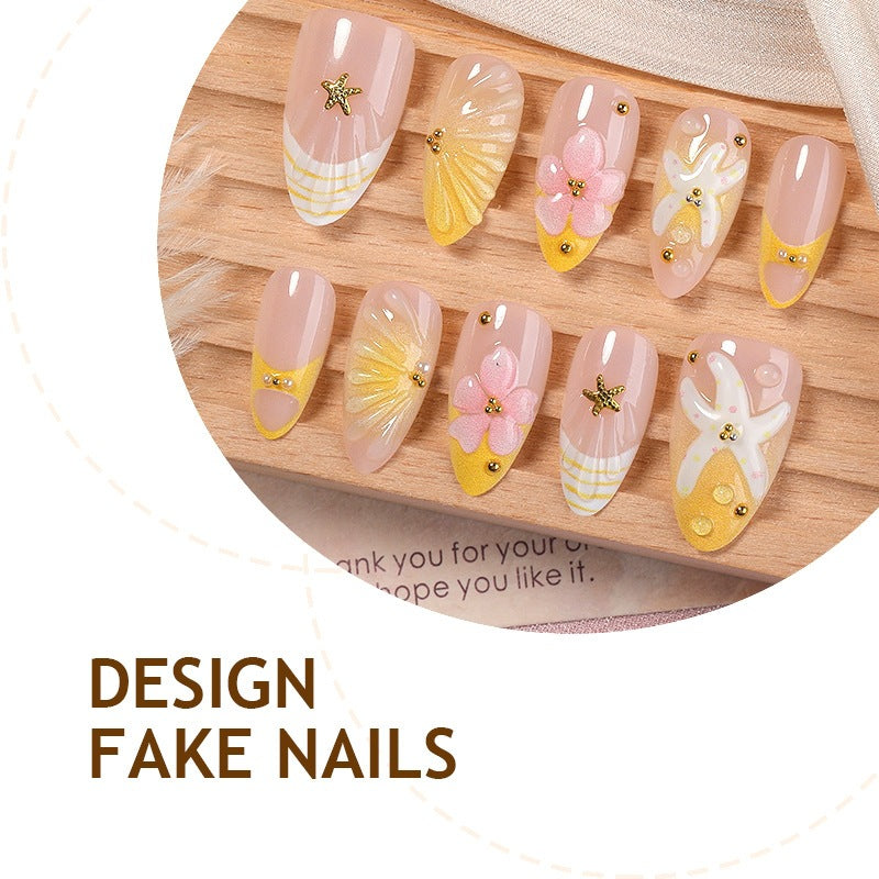 Nail art set with handmade floral accents and glitter details Stornfield