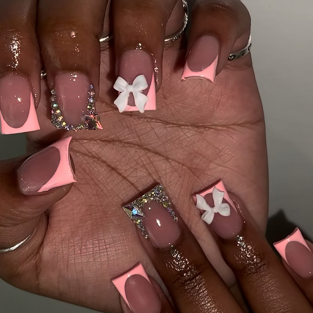 Decorative Acrylic Nail Enhancements with Bow and Rhinestone Accents Stornfield