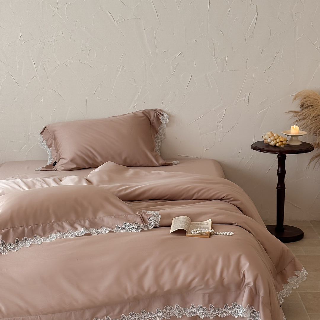 Satin bedding set with silky-smooth texture and floral lace trim