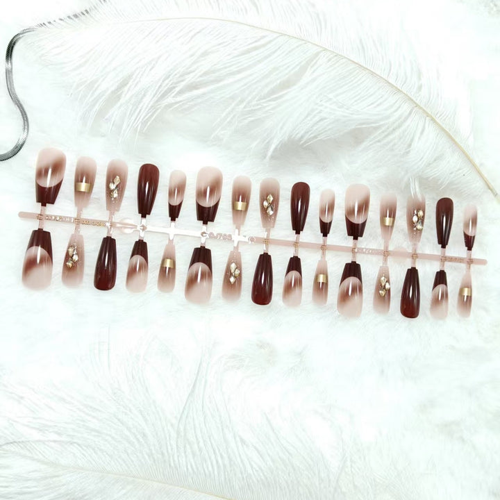 Artificial nails with elegant color gradients and jewelry details Stornfield