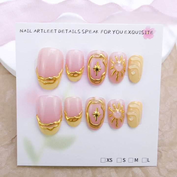 Acrylic nail set with elegant gold embellishments and creative designs Stornfield