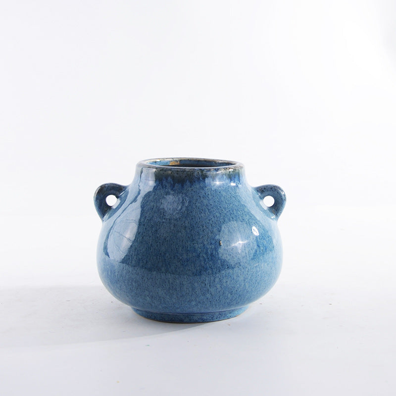 Decorative ceramic pot with playful handles Stornfield