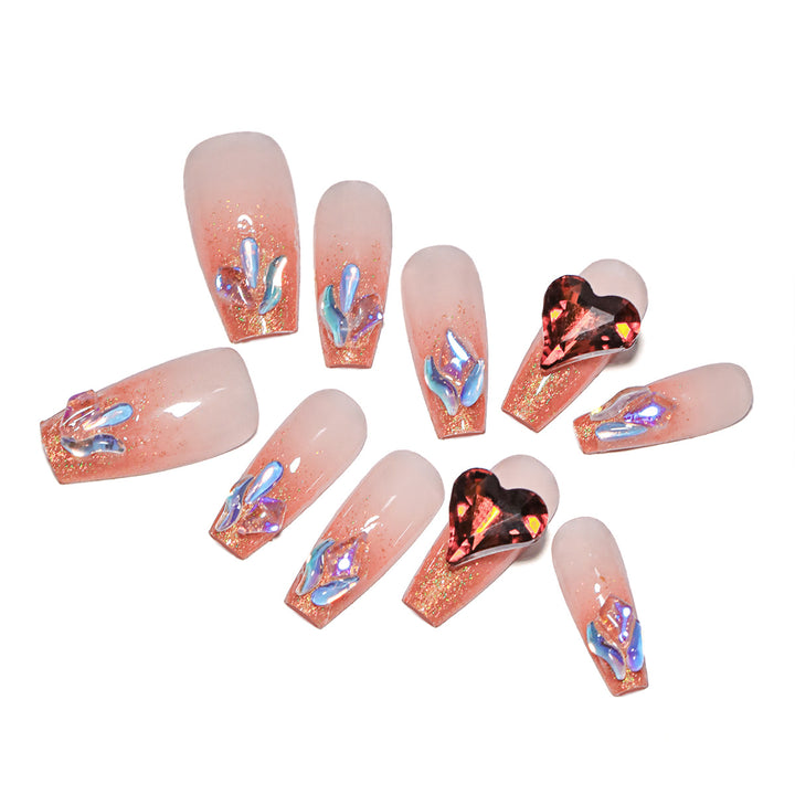 Artistic acrylic nails with heart design and sparkling accents Stornfield