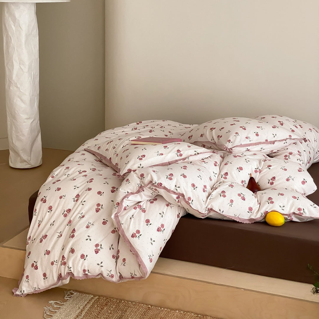 Finely woven cotton percale bedding set with delicate floral print and crocheted lace edge