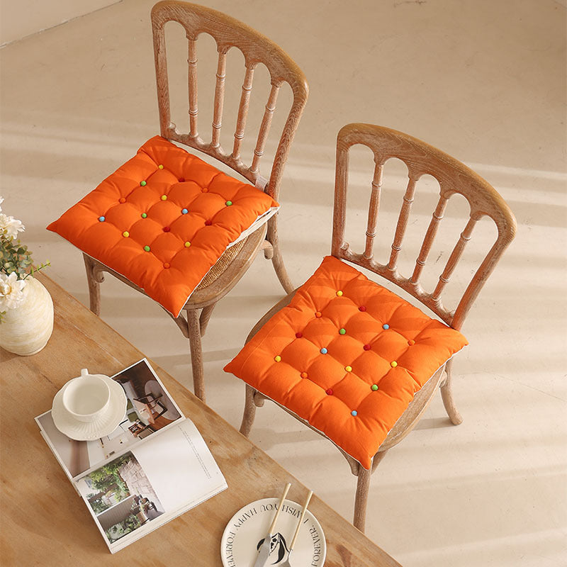 Padded quilted seat cushion with colorful button applications and non-slip underside Stornfield