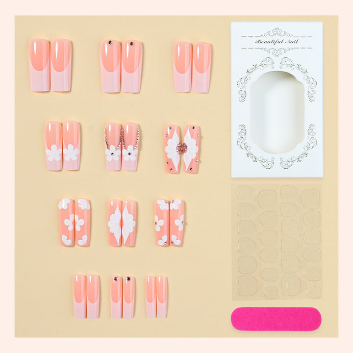 Artificial nail set with delicate flower and glitter details Stornfield
