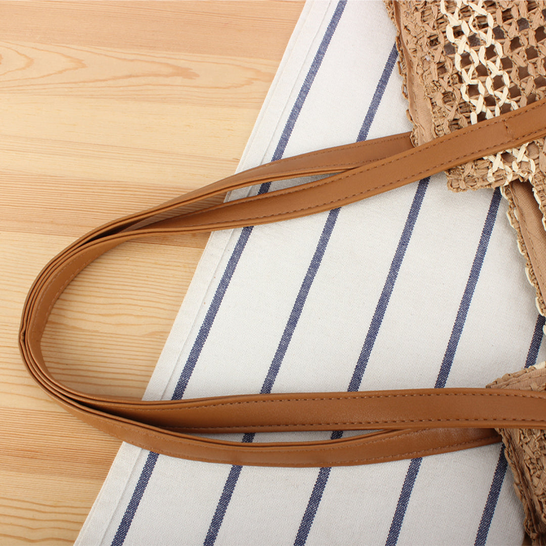 Shopping bag made of woven natural material with elegant leather handles Stornfield