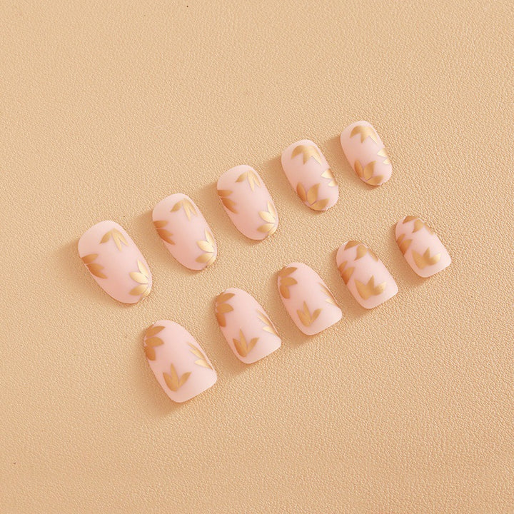 Artificial nail set with elegant gold leaf design Stornfield