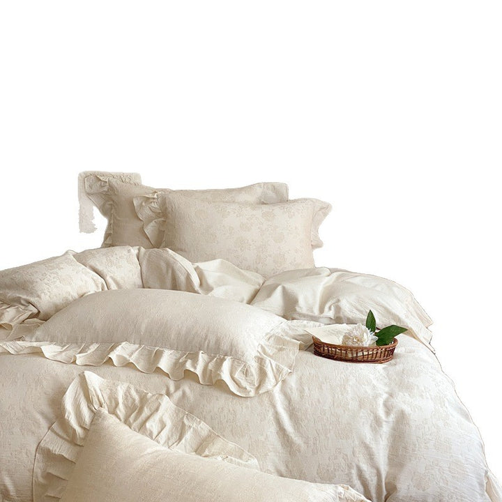 Jacquard bedding set with decorative ruffle border and floral relief