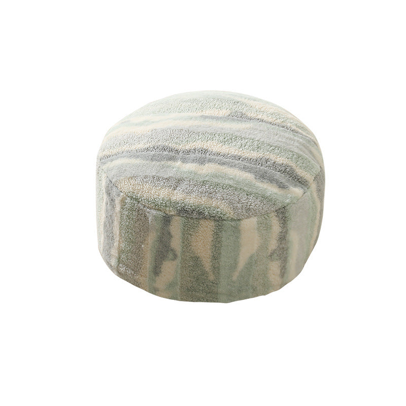 Round seating pouf made of teddy fleece with soft textured cover