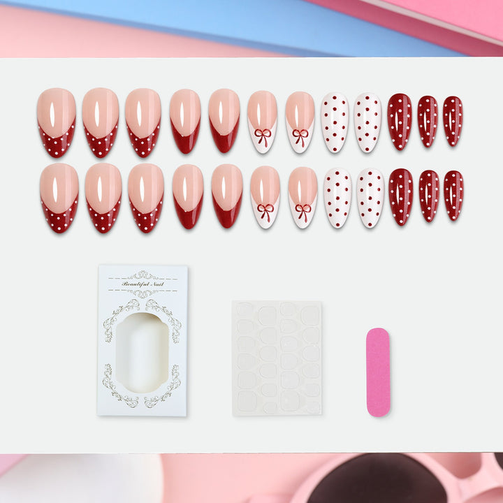 Nail set with elegant bows and polka dots Stornfield