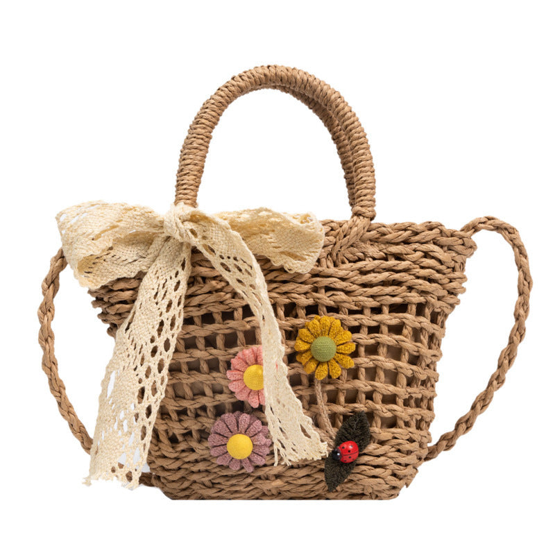 Playful basket bag with floral appliqués Stornfield