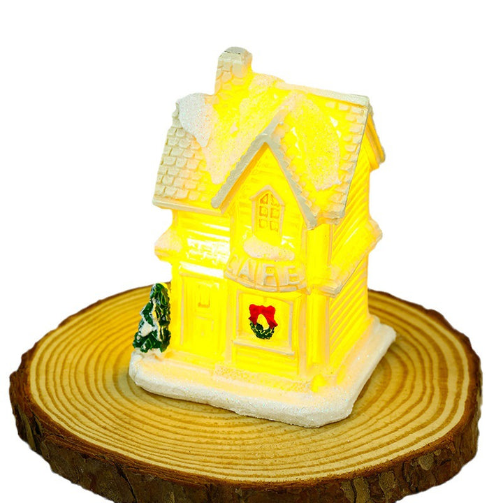 Illuminated Christmas village house with festive decoration Stornfield