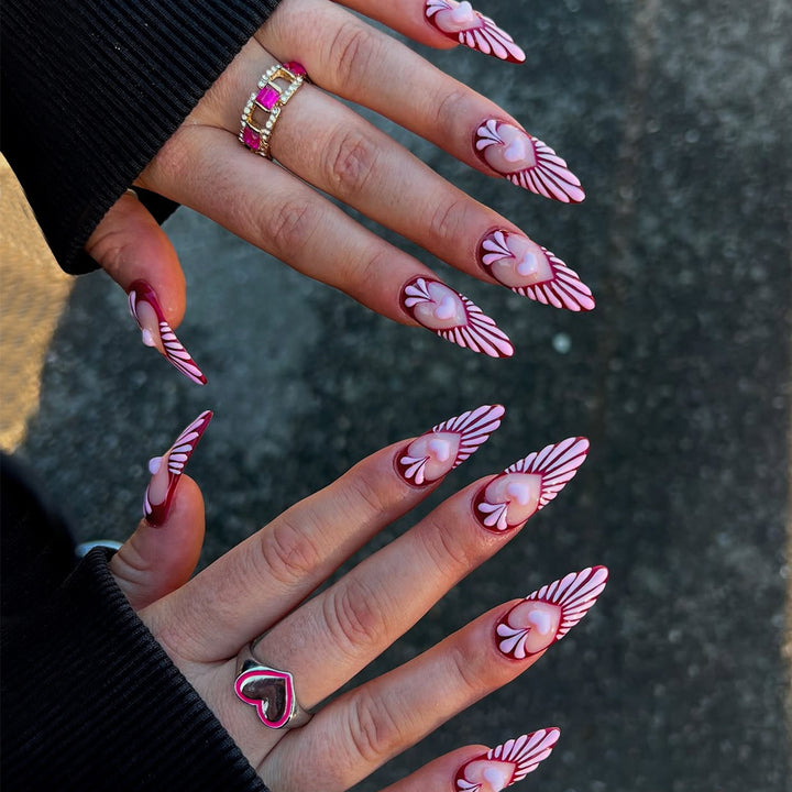 Artificial nails with playful heart design and elegant accents Stornfield
