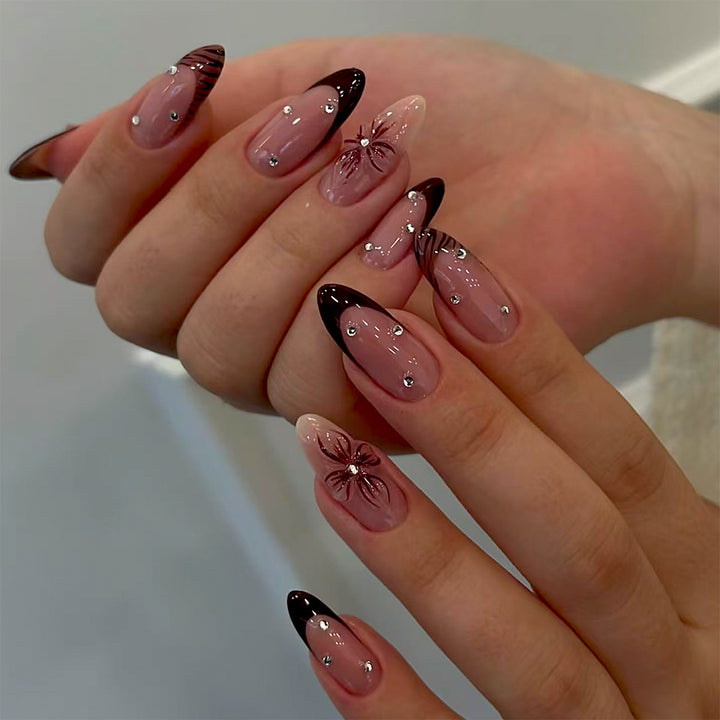 Artificial nails with elegant flower design and glitter accents Stornfield