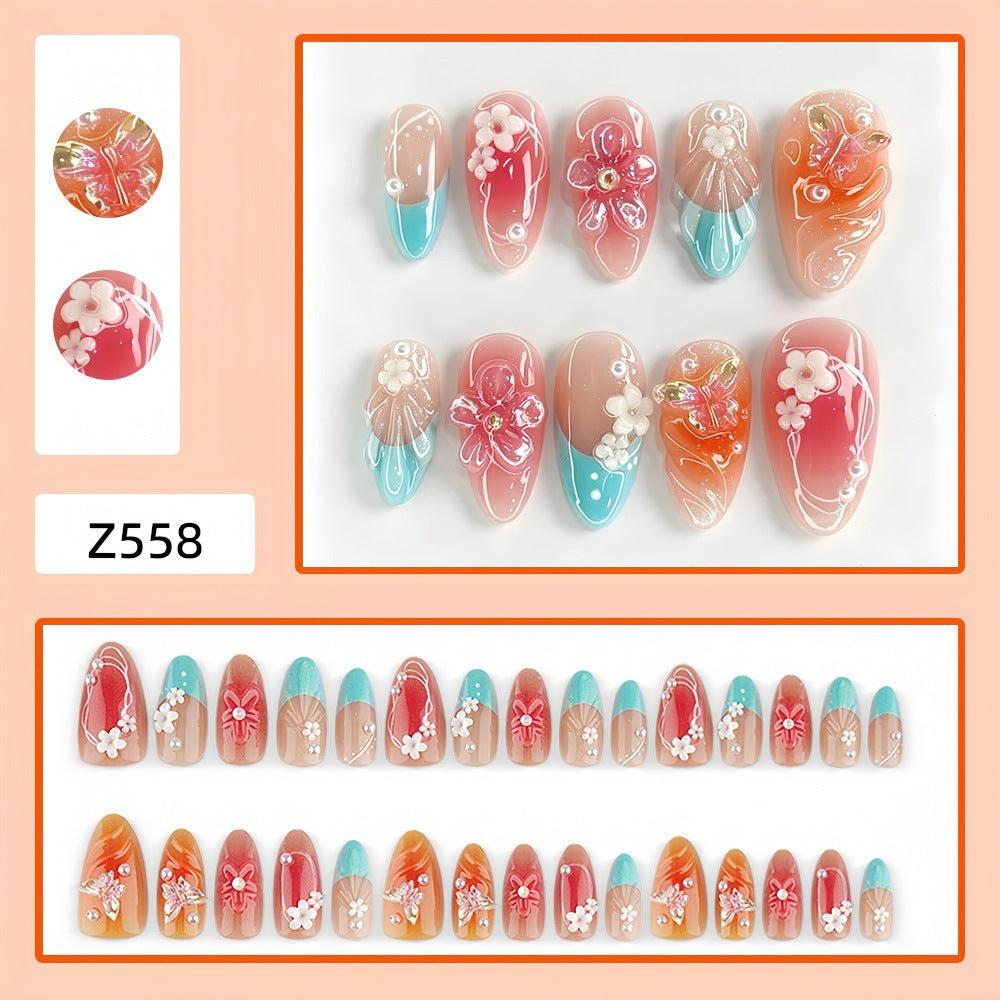 Artificial nail set with floral accents and glittering 3D applications Stornfield
