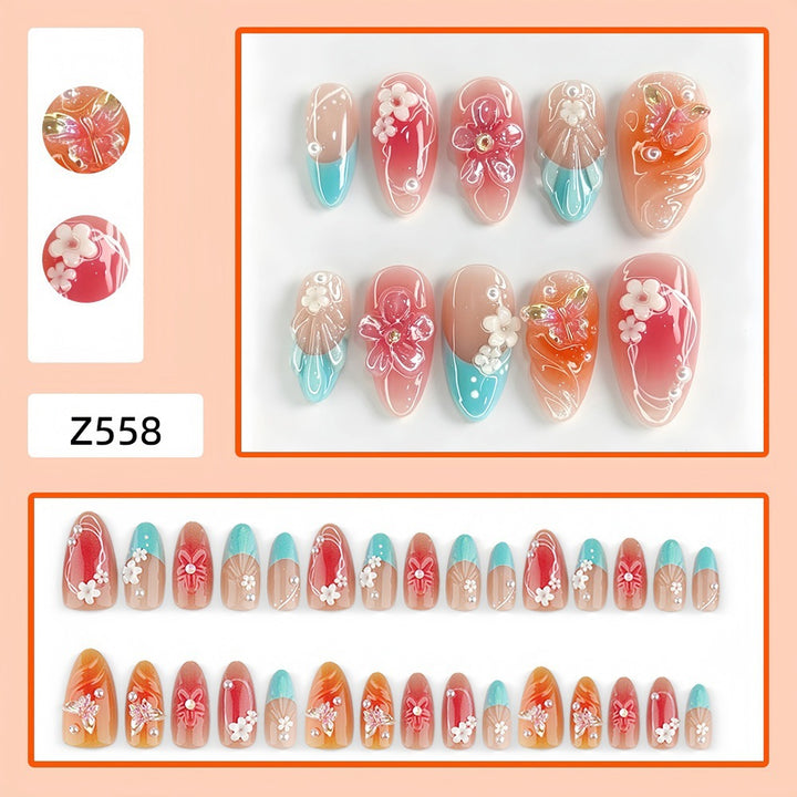 Artificial nail set with floral accents and glittering 3D applications Stornfield