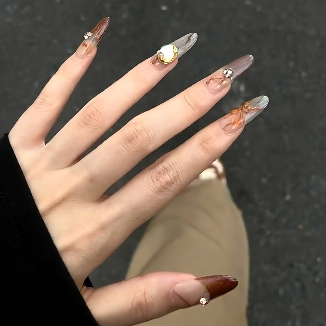 Artificial nails with elegant 3D details and sparkling accents Stornfield