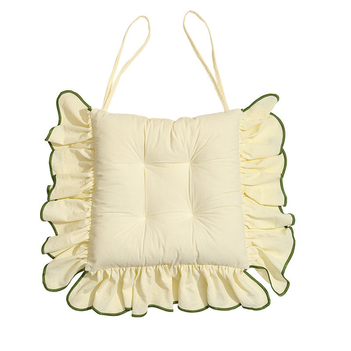 Padded chair cushion with ruffle and fastening bands