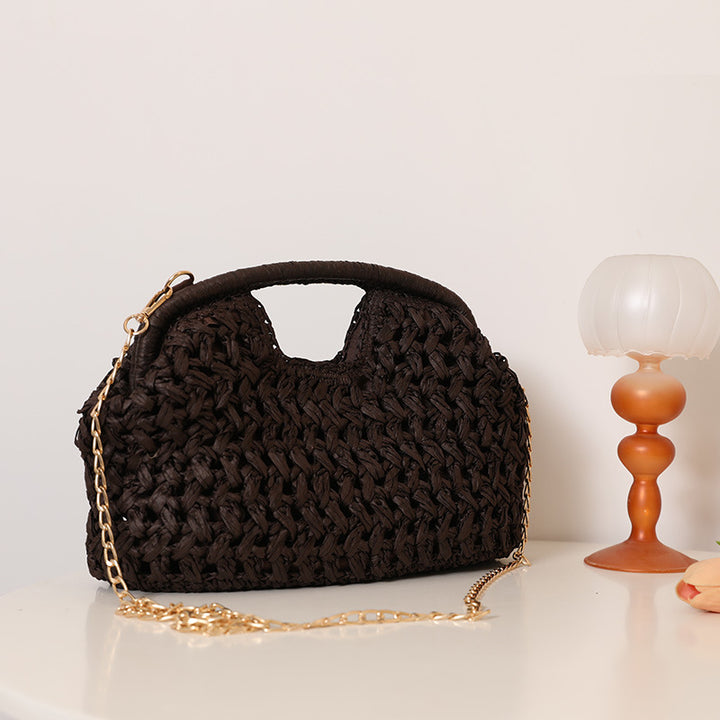 Handcrafted rattan bag with elegant handles and chain straps Stornfield