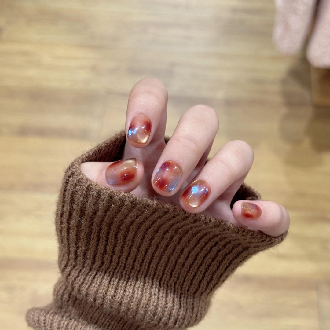 Artificial nails with shimmering galaxy patterns Stornfield