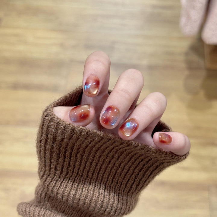 Artificial nails with shimmering galaxy patterns Stornfield
