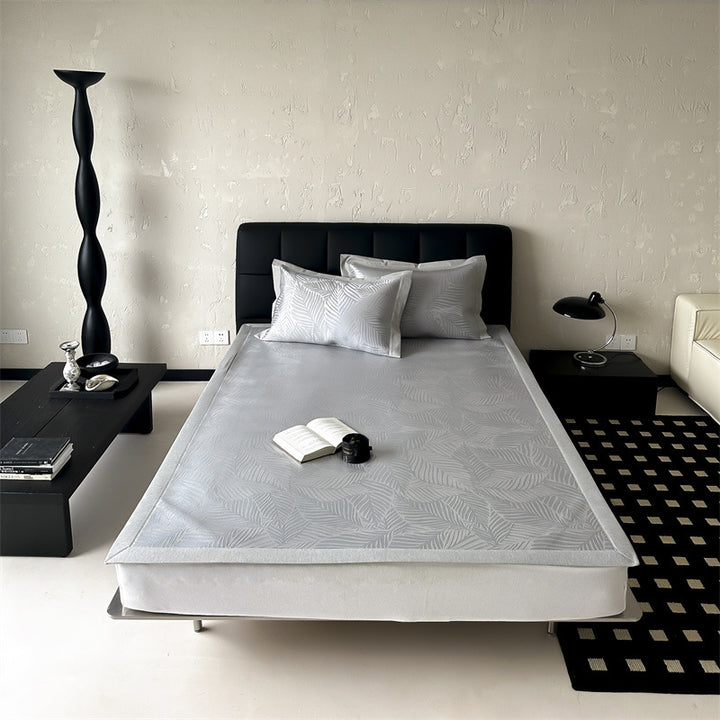 high-quality non-slip mattress protector with integrated fitted sheet and elegant jacquard pattern