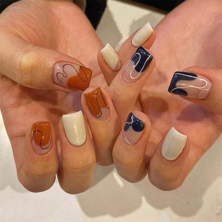 Artful nail extensions with an elegant leaf pattern Stornfield