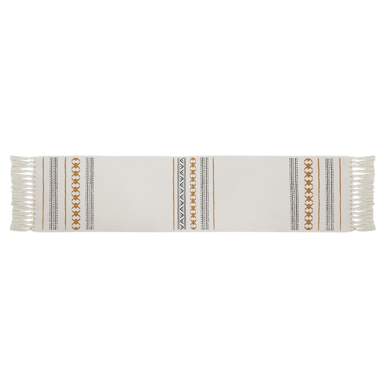 Woven Boho table runner made of cotton blend with decorative fringes and graphic stripe pattern Stornfield