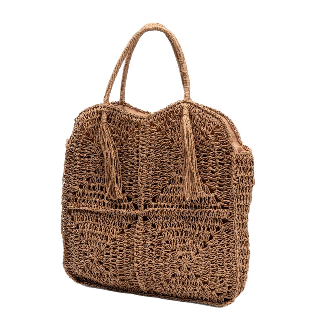 Spacious handbag made of braided natural material with fringes Stornfield