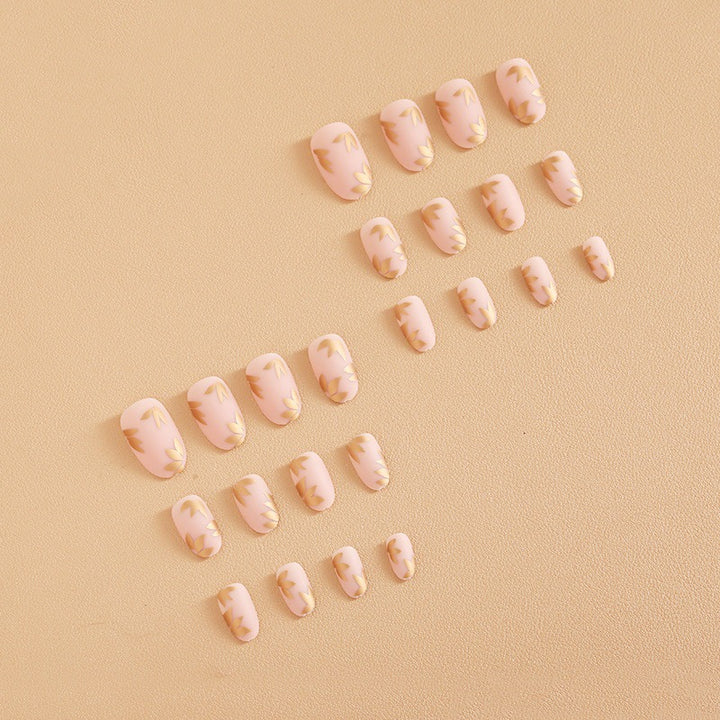 Artificial nail set with elegant gold leaf design Stornfield