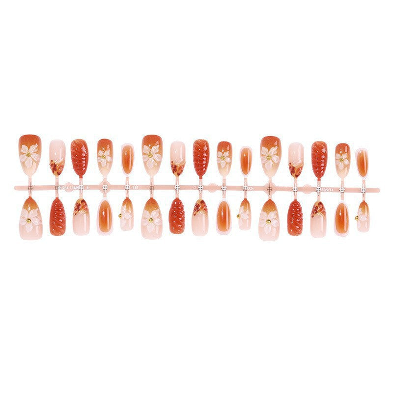 Artificial nail set with handcrafted flowers and elegant embellishments Stornfield