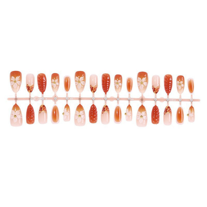 Artificial nail set with handcrafted flowers and elegant embellishments Stornfield