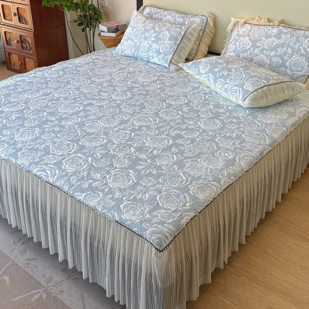 Quilted mattress and pillow set with butterfly motif and pleated bed ruffle