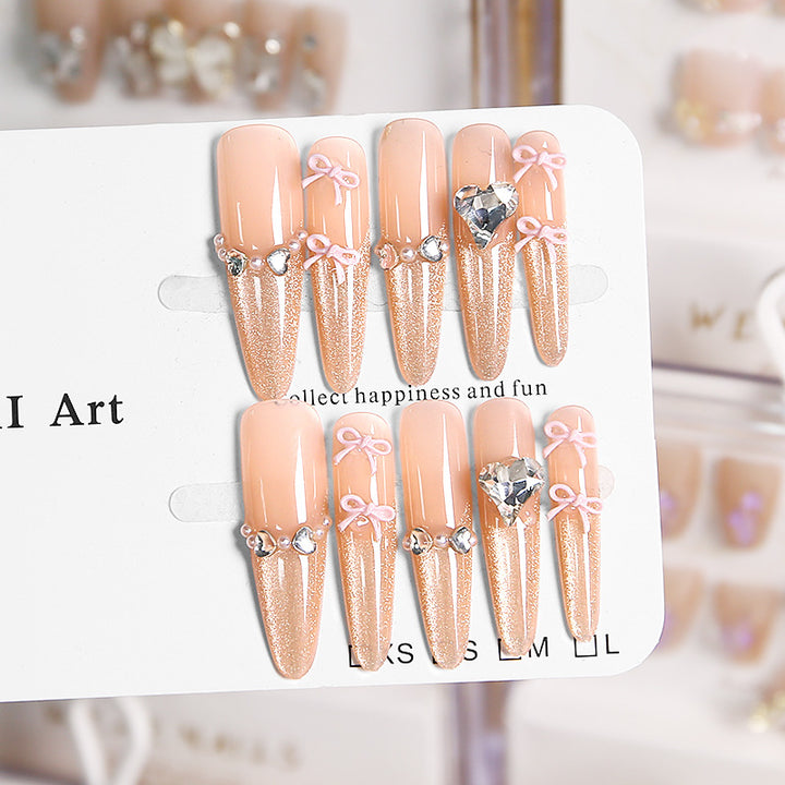 Art nail set with sparkling tips and delicate bow decorations Stornfield