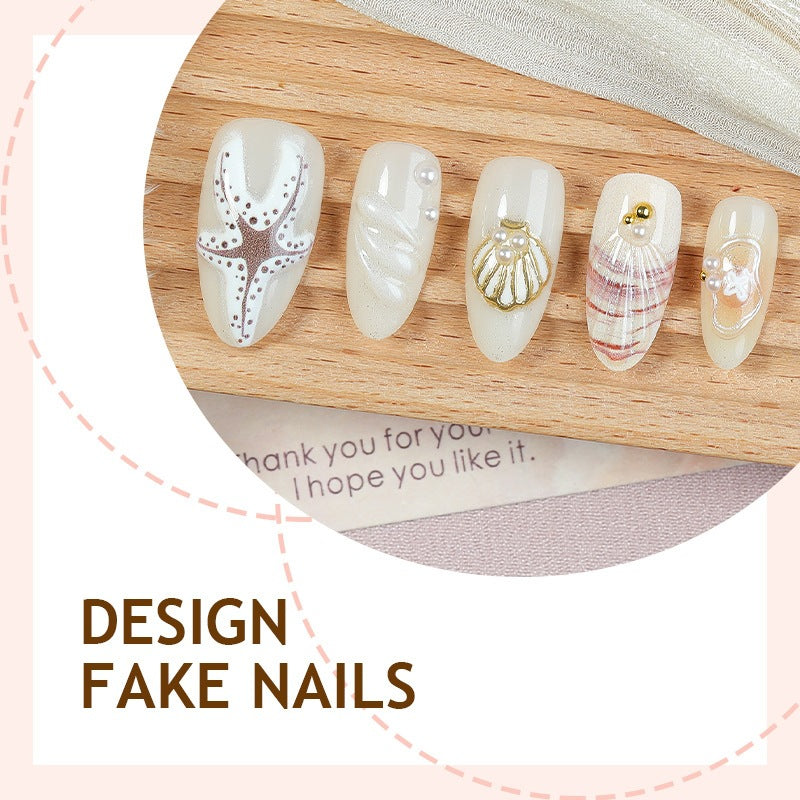 luxurious artificial nail set with maritime designs and golden accents Stornfield