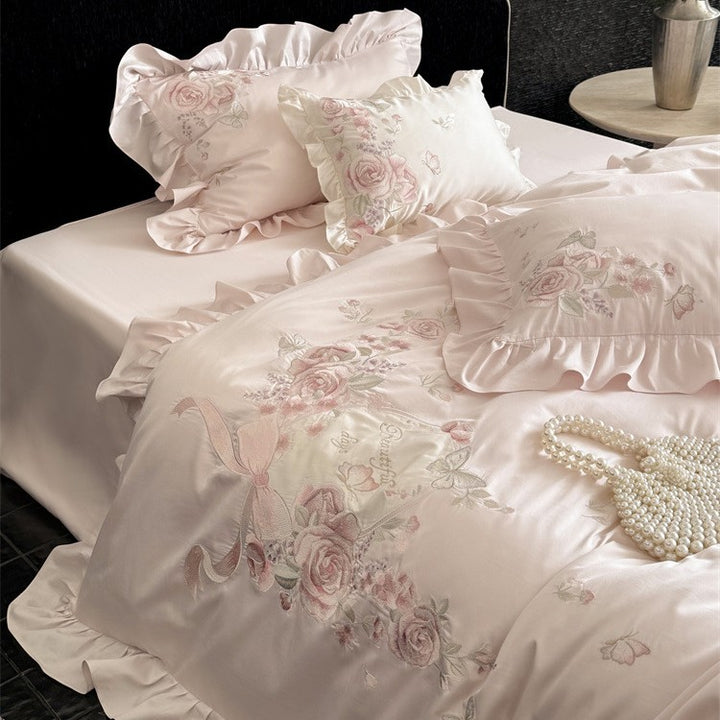 Luxurious satin bedding set with floral embroidery, ruffled edge and silky-matte finish Stornfield