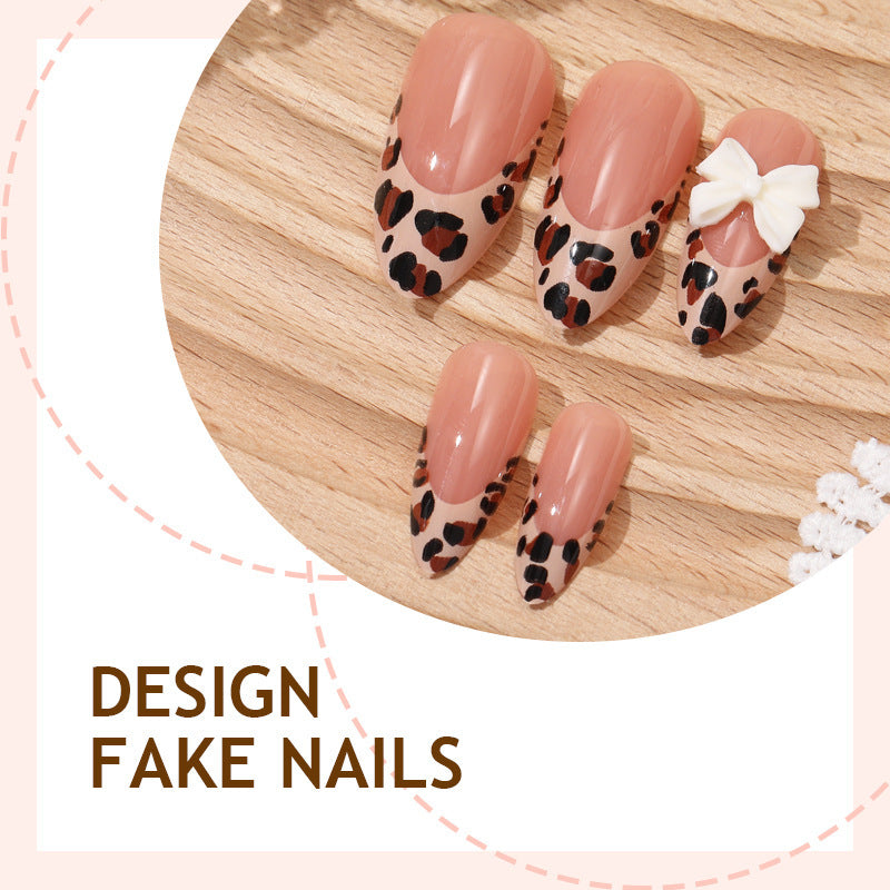 Creative nail art set with vibrant leopard pattern and delicate ribbons Stornfield