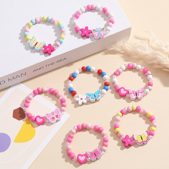 Playful bracelet with heart and butterfly charms Stornfield