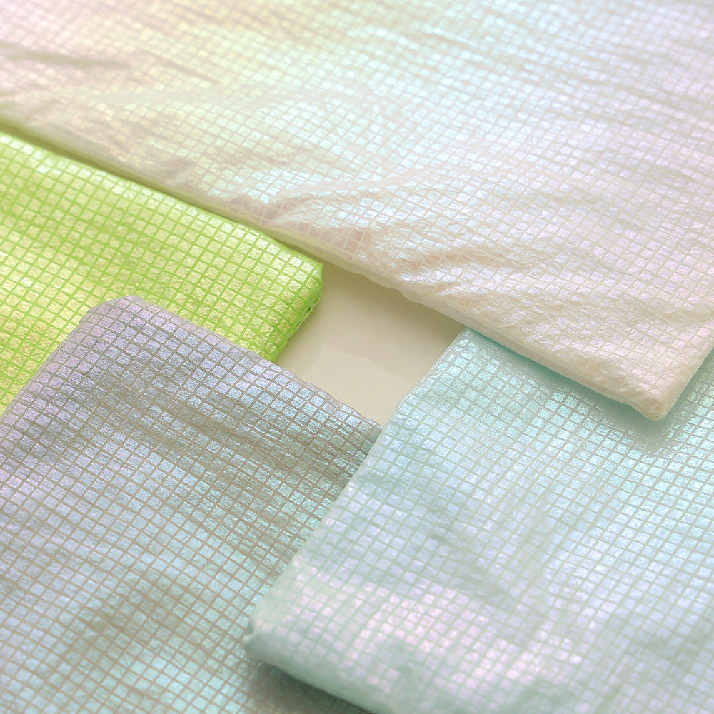 Square decorative cushion with delicate mother-of-pearl look and fine micro tuft structure