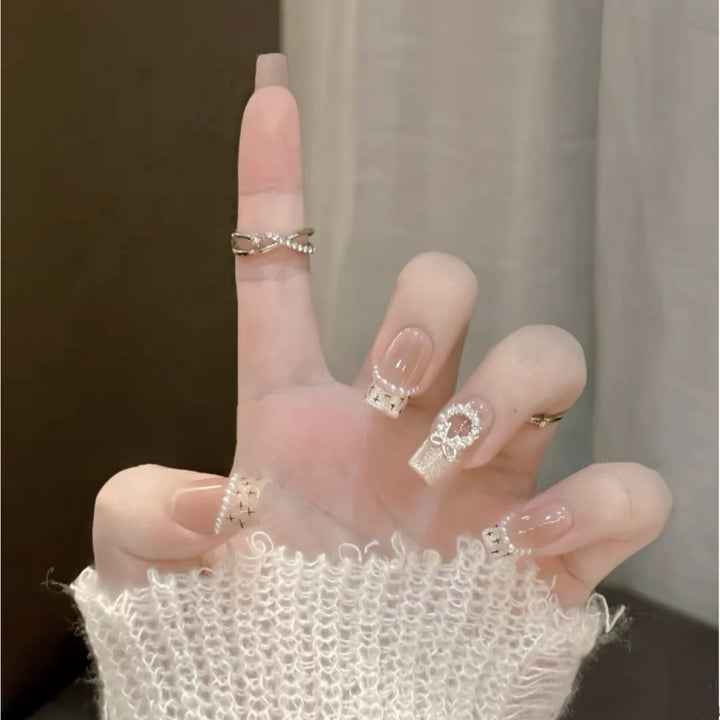 Glamorous artificial nails with sparkling decorations Stornfield