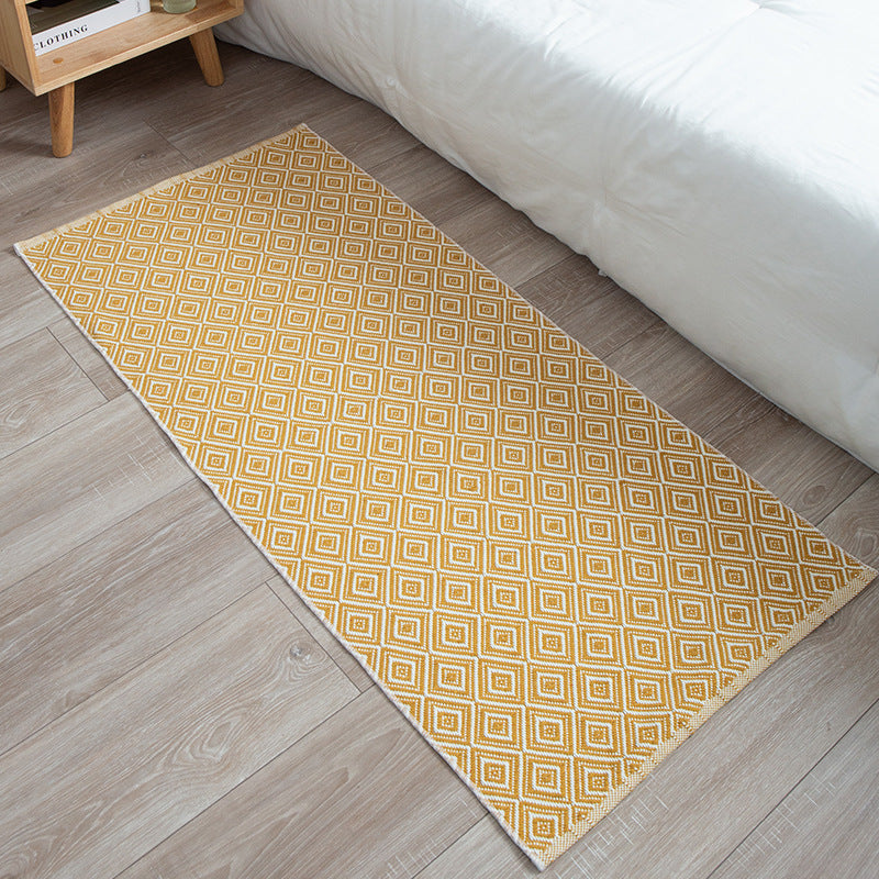 woven living room runner with fringes and geometric weave pattern