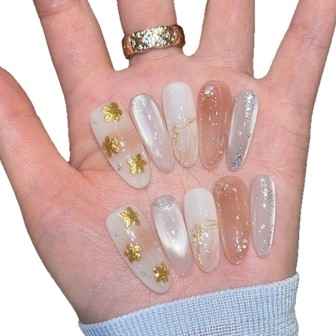 Artificial nails with floral decorations and glitter effects Stornfield