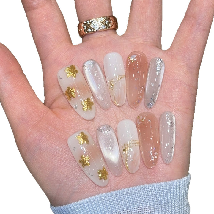 Artificial nails with floral decorations and glitter effects Stornfield