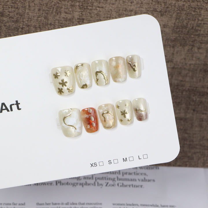Elegant Press-On Nail Art Set with Unique Metallic Designs Stornfield